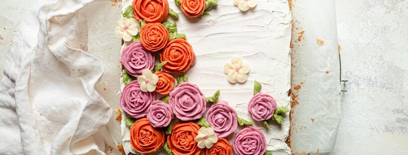 gluten-free vanilla bean cake decorated with floral buttercream