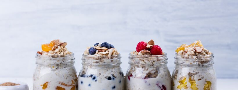 overnight oats in a mason jar topped with nuts, berries and fruit