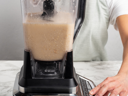 Oats and water in a blender