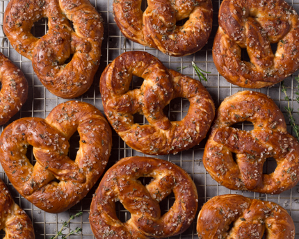 Baked pretzels cooling on a wire rack