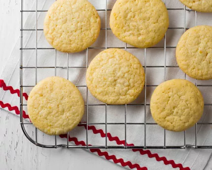 Lemon sugar cookies on a wire cooling rack