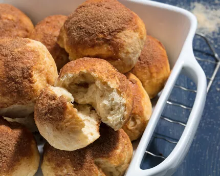 Pile of sweet rolls in casserole dish