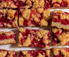 A dozen raspberry crumble bars